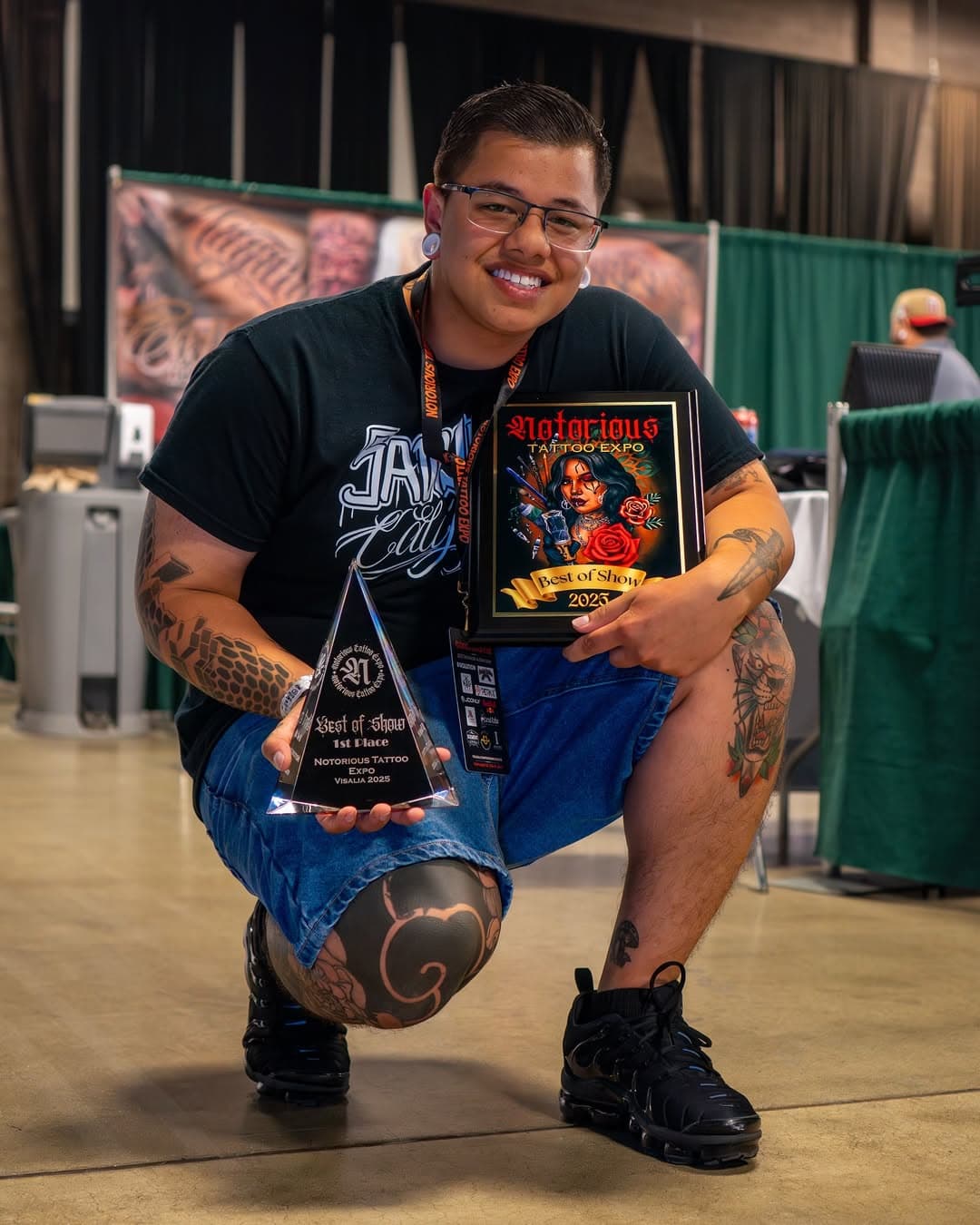 Wayra Pineda holding the Best of the Show trophy at Notorious Tattoo Expo 2025